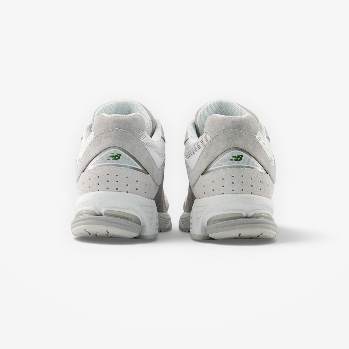 Back view of New Balance grey sneakers, premium suede and mesh footwear for men