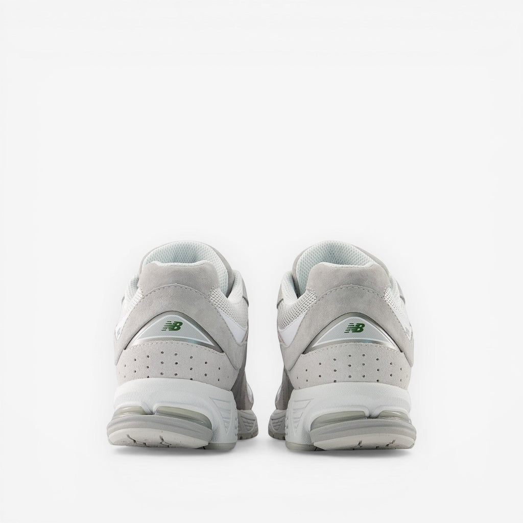 Back view of New Balance grey sneakers, premium suede and mesh footwear for men