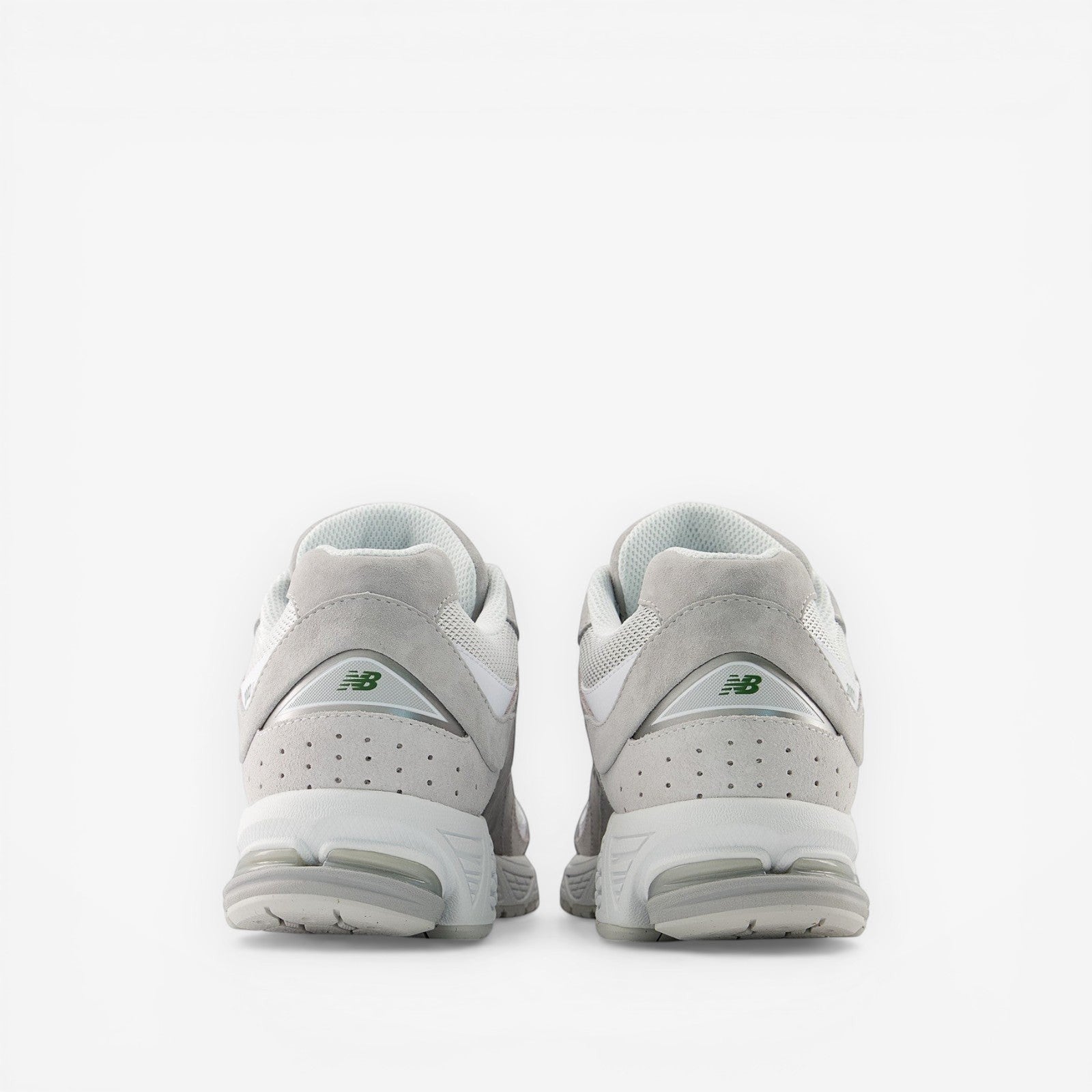 Back view of New Balance grey sneakers, premium suede and mesh footwear for men