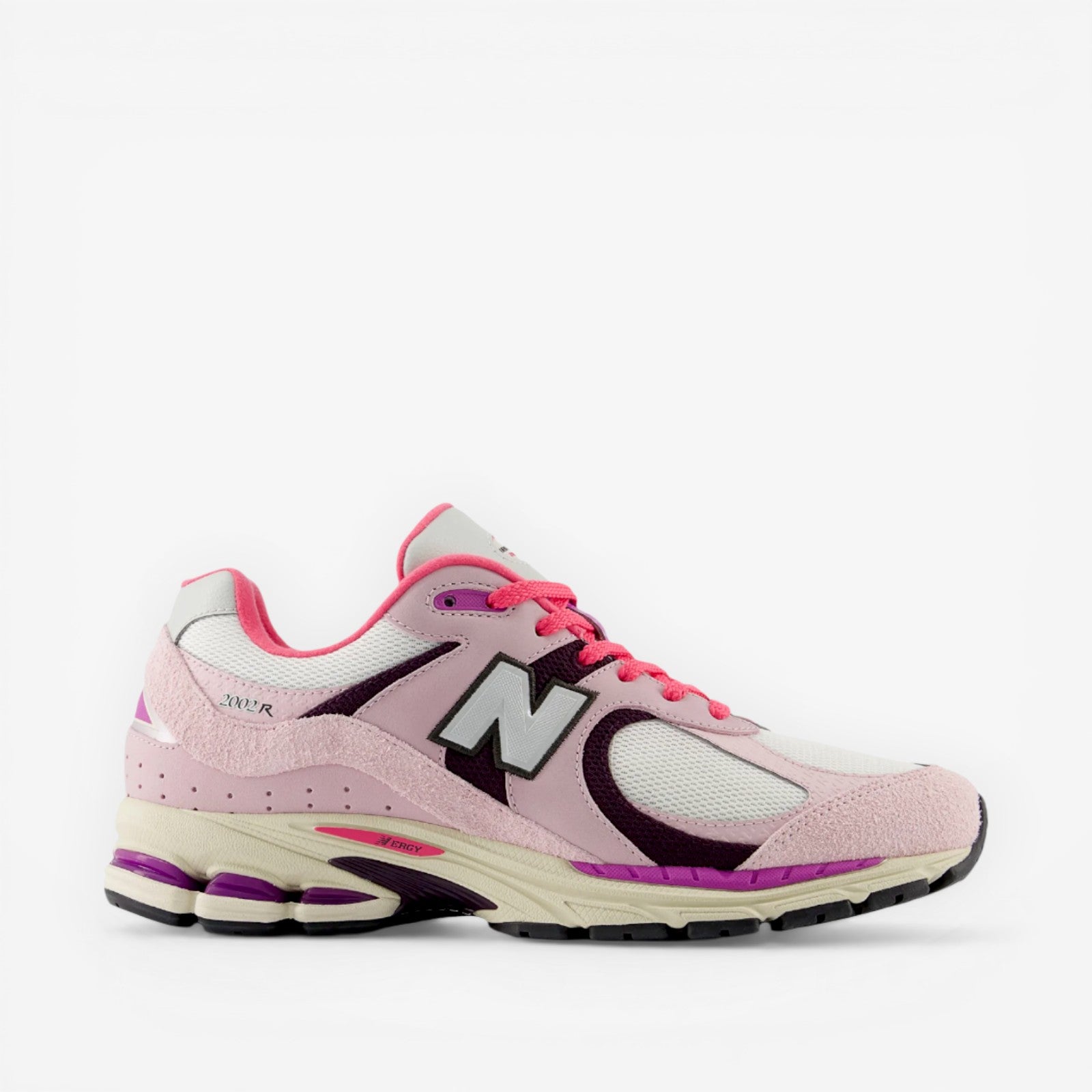 Pink and white New Balance sneaker with mesh and suede details, lifestyle footwear