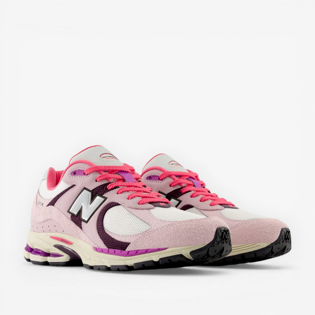 Pink and white New Balance sneakers with vivid laces, premium footwear for sneaker enthusiasts