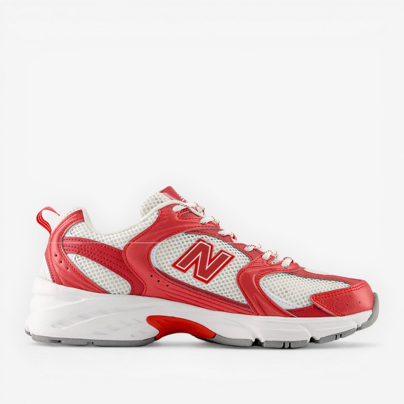 New Balance sneaker in white and red, mesh upper, athletic footwear, side profile