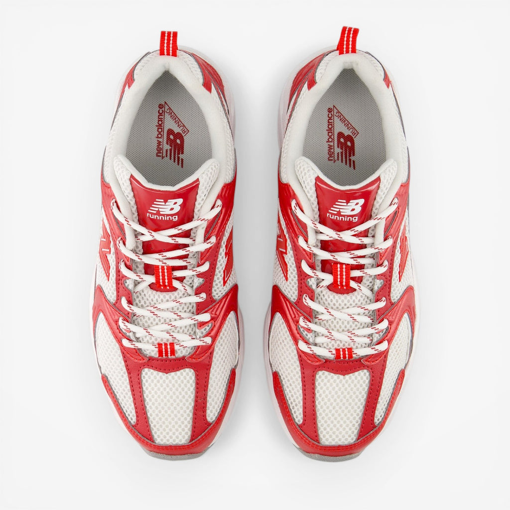 Pair of New Balance red and white running sneakers, mesh upper, white laces, top view