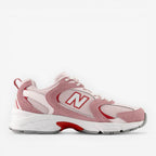 New Balance pink and white mesh sneaker with red accents, athletic footwear