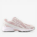 Light pink New Balance sneaker with mesh upper and white sole, stylish athletic footwear