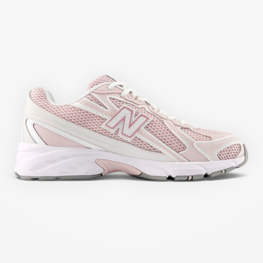 Light pink New Balance sneaker with mesh upper and white sole, stylish athletic footwear