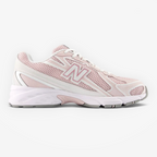 Light pink New Balance sneaker with mesh upper and white sole, stylish athletic footwear