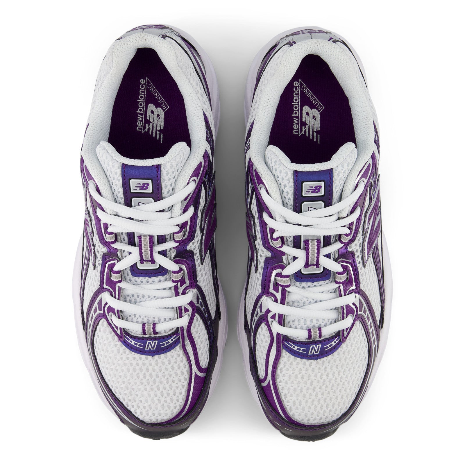 White and purple New Balance sneakers, mesh upper, top view, athletic footwear