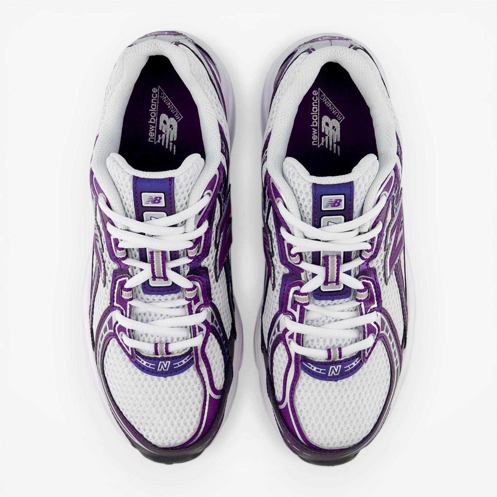 White and purple New Balance sneakers, mesh upper, top view, athletic footwear