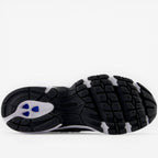 new balance sneaker outsole black and white with blue accents, footwear detail
