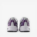 Rear view of white and purple New Balance sneakers, athletic footwear, mesh and synthetic details