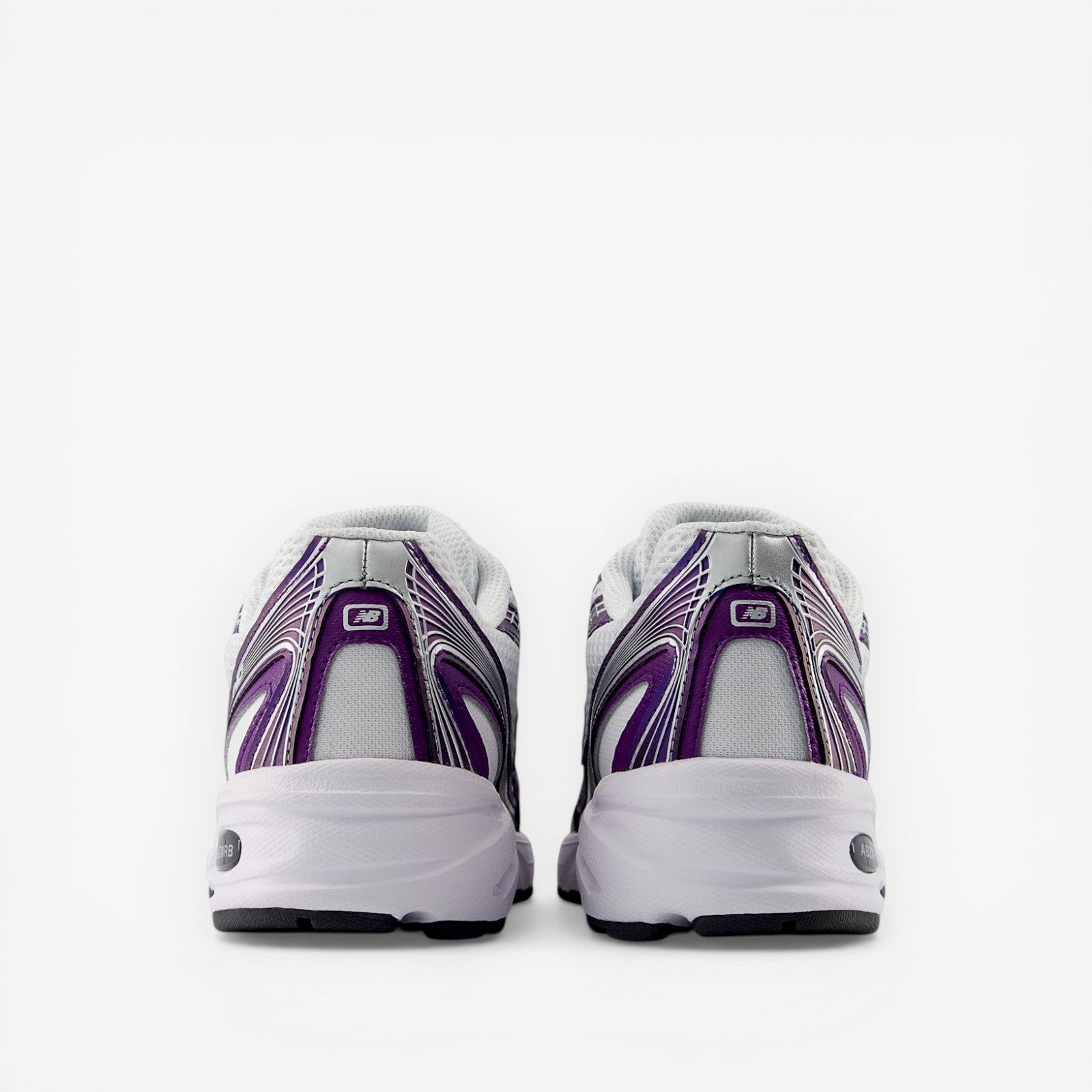 Rear view of white and purple New Balance sneakers, athletic footwear, mesh and synthetic details
