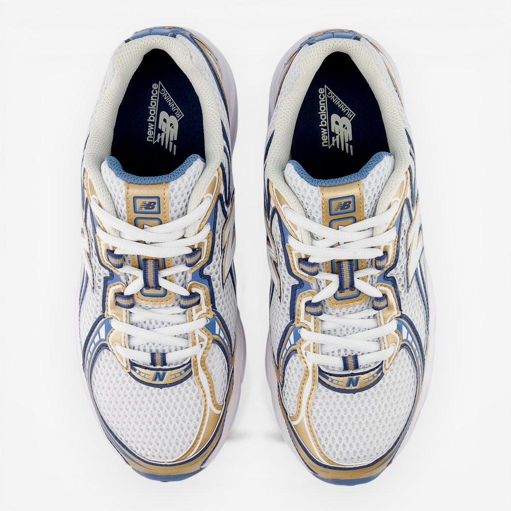 New Balance sneakers in white, gold, and blue with mesh upper, viewed from above.