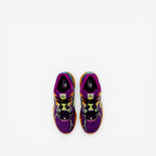 New Balance sneakers in purple mesh with orange, teal, and black accents, top view