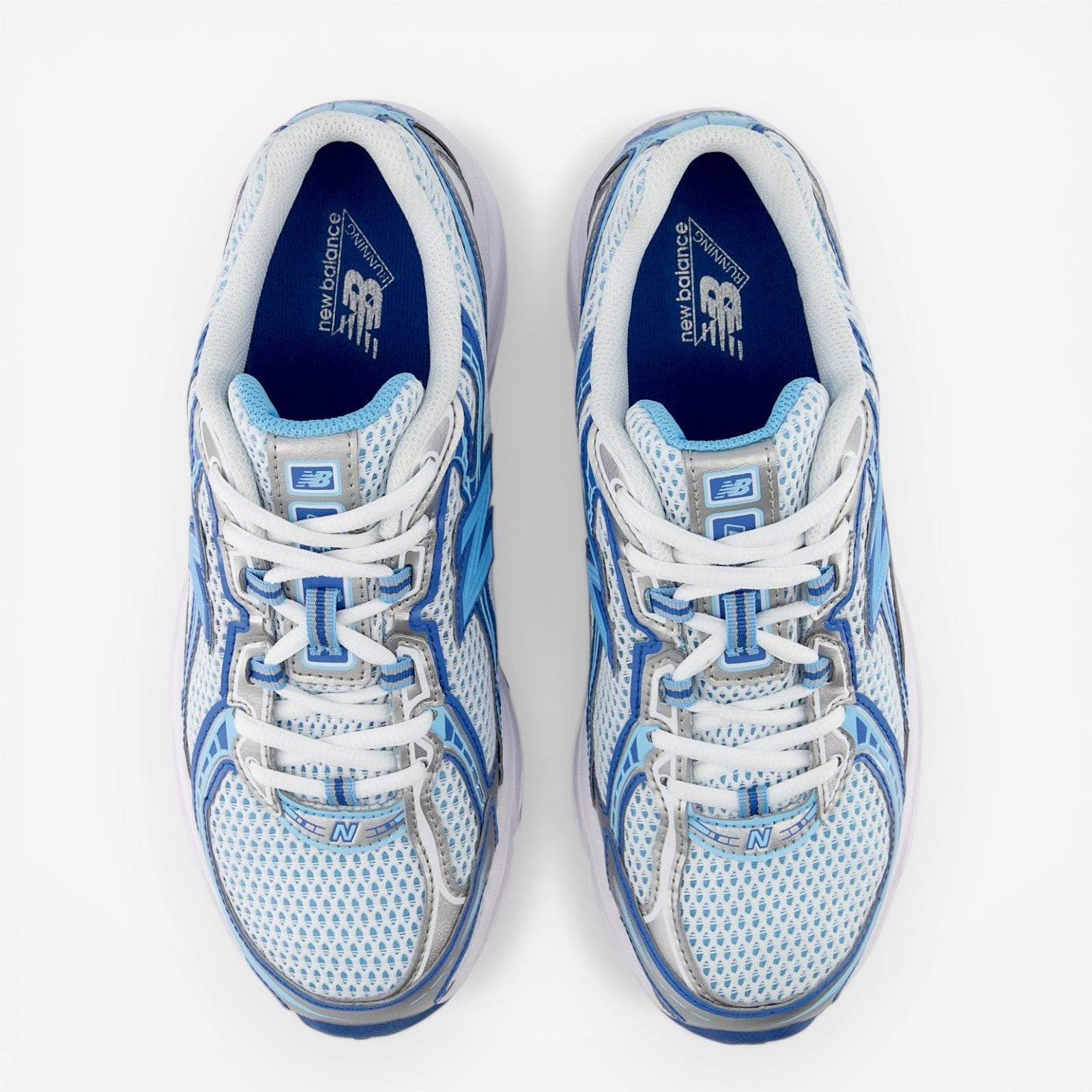 New Balance sneakers in white and blue mesh, athletic footwear top view