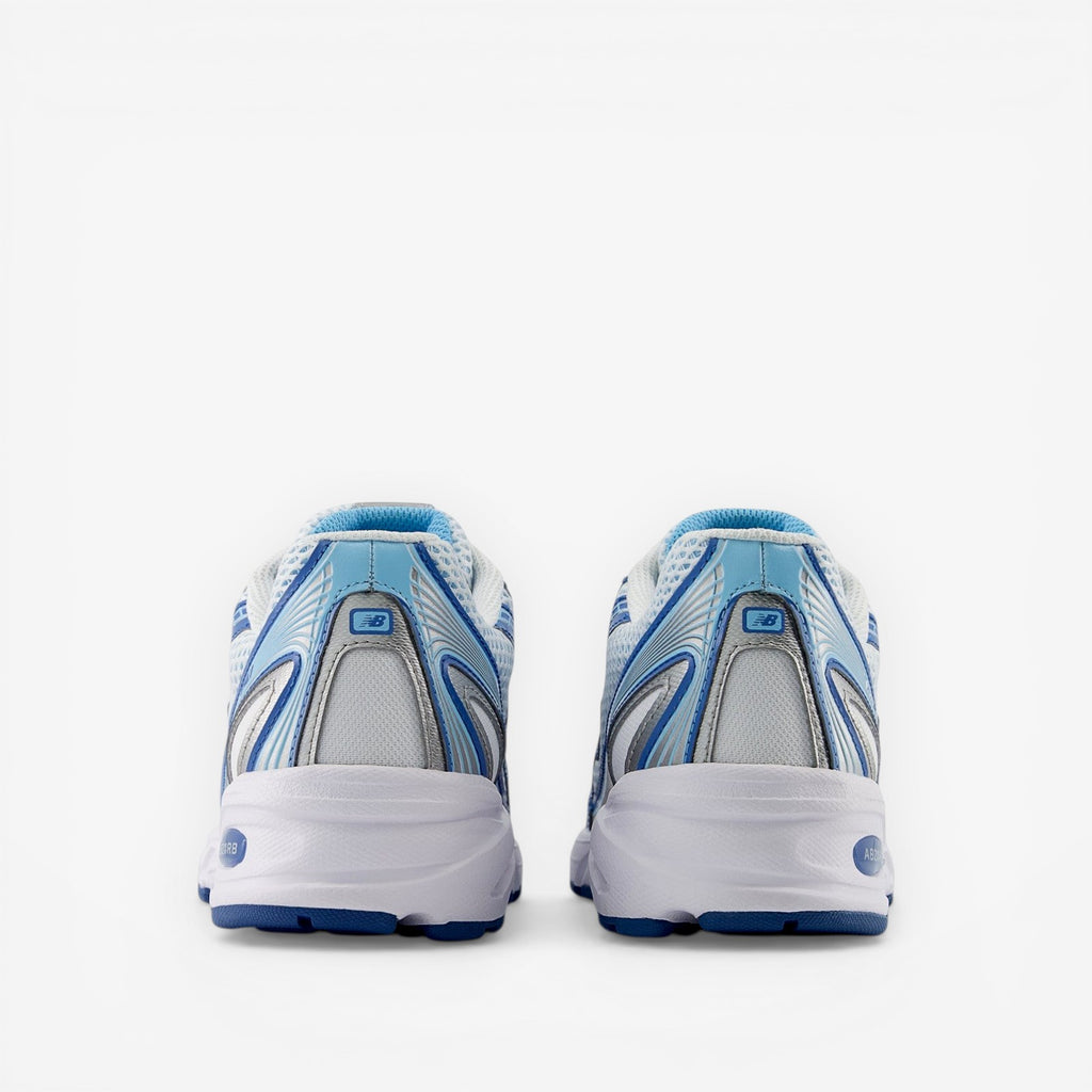 Rear view of blue and white New Balance sneakers, athletic footwear, mesh and synthetic design