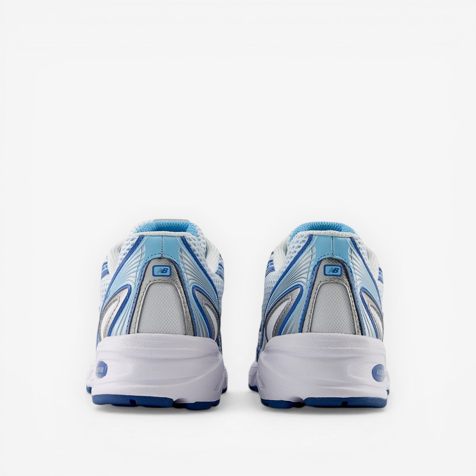 Rear view of blue and white New Balance sneakers, athletic footwear, mesh and synthetic design