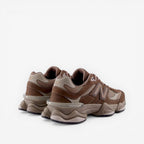 Brown and beige New Balance sneakers, athletic footwear with chunky sole, side angle view
