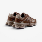 Brown and beige New Balance sneakers, athletic footwear with chunky sole, side angle view