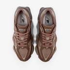 Brown New Balance 9060 sneakers top view, mesh and suede athletic footwear