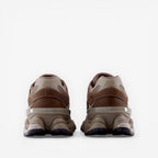 rear view of brown New Balance sneakers, athletic footwear with mesh and suede details