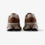 rear view of brown New Balance sneakers, athletic footwear with mesh and suede details
