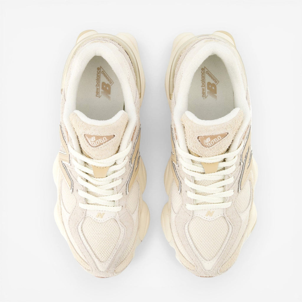 top view beige New Balance sneakers with mesh and suede details, laced, on black background