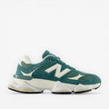 Teal New Balance sneaker with white sole and mesh panels, stylish athletic footwear