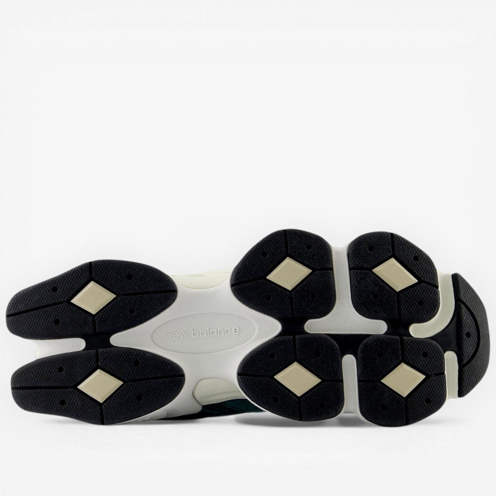 New Balance sneaker outsole with black geometric grip, athletic footwear design