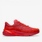 Red New Balance sneaker with mesh and suede panels, athletic footwear for men