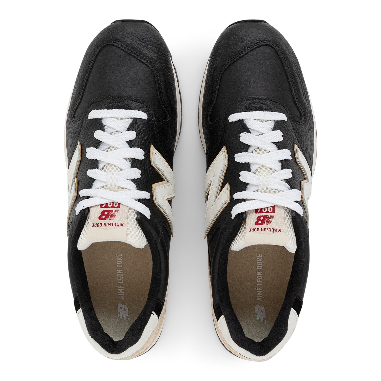 Black and white New Balance sneakers with white laces, viewed from above, lifestyle footwear