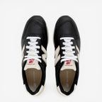 Black and white New Balance sneakers with white laces, viewed from above, lifestyle footwear