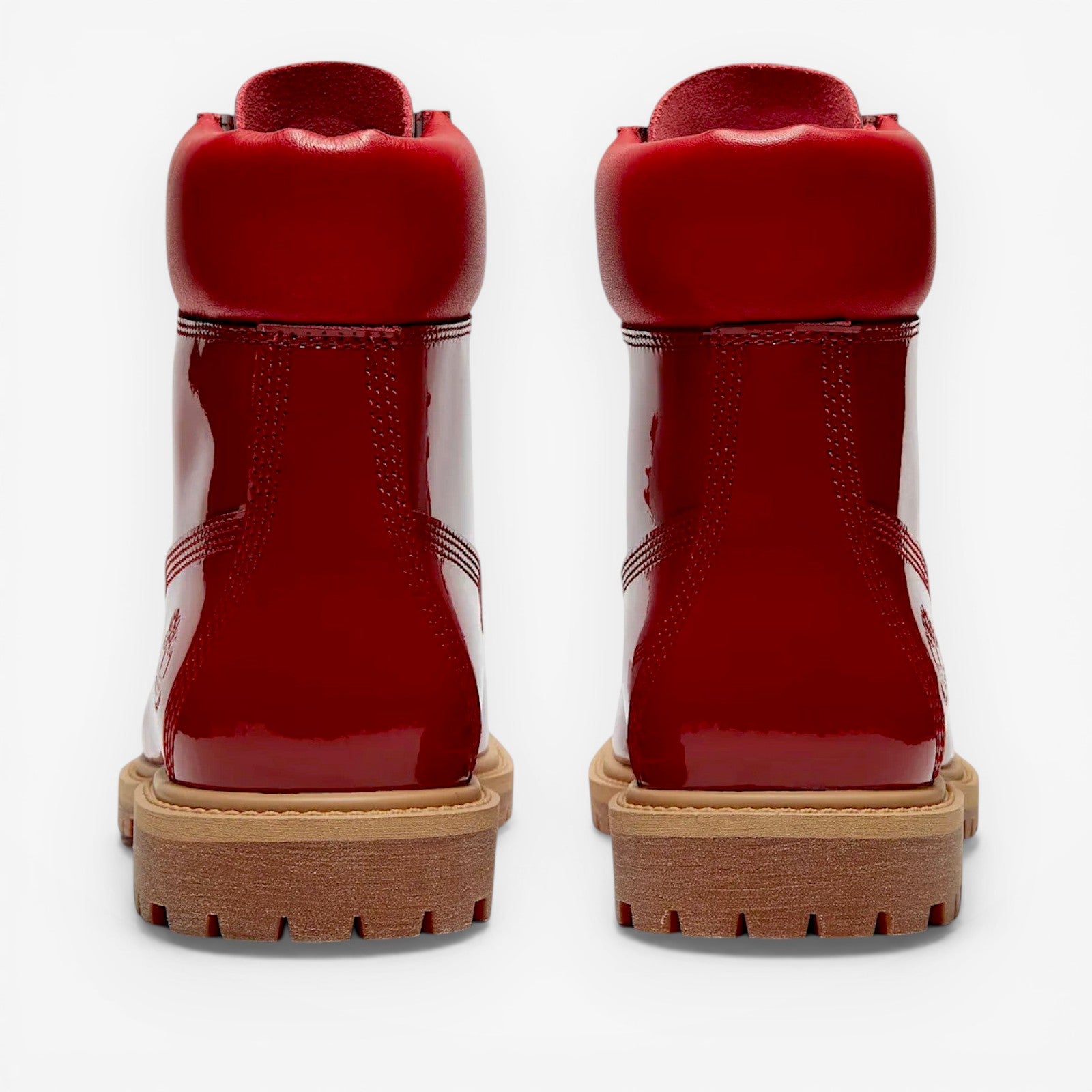 METRO Women's Timberland Premium 6-Inch red patent leather waterproof boots with padded collar and lug sole.