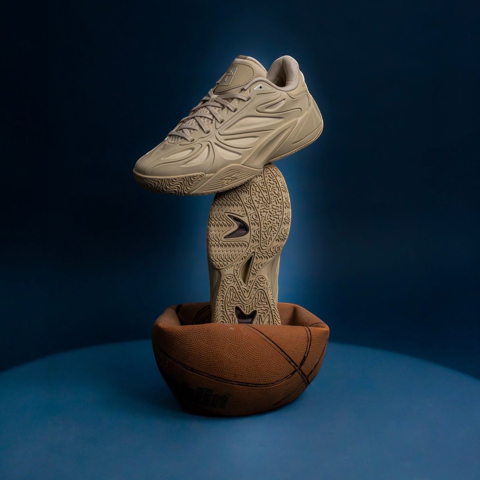 METRO Angel Reese 1 basketball shoes in beige with engineered mesh upper, balanced on a basketball against blue backdrop