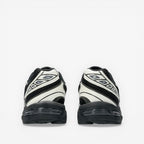 METRO ASICS GEL-1130 black and cream retro running shoes with mesh and synthetic overlays.
