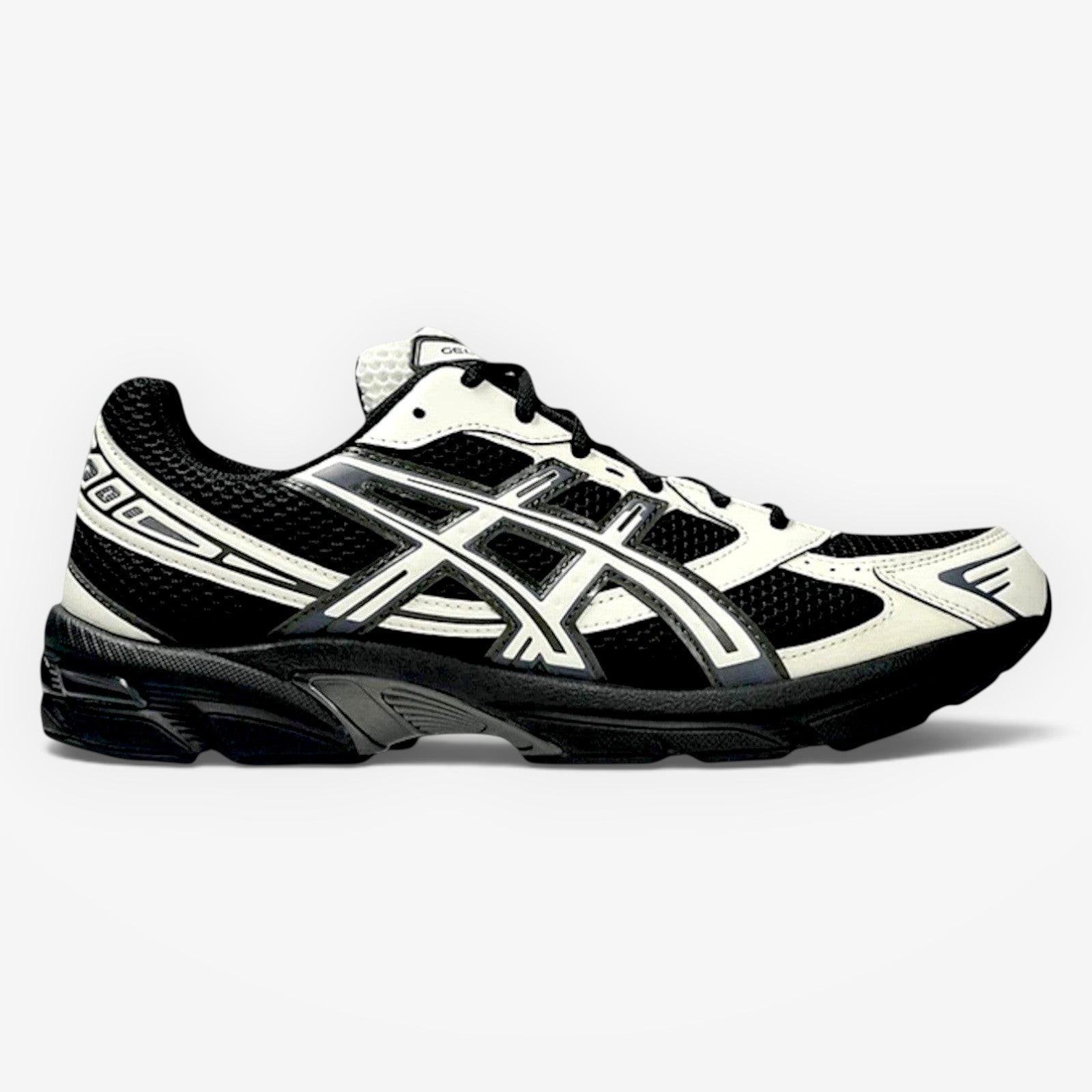 METRO ASICS GEL-1130 sneaker in black and cream with breathable mesh, synthetic overlays, and GEL heel cushioning.