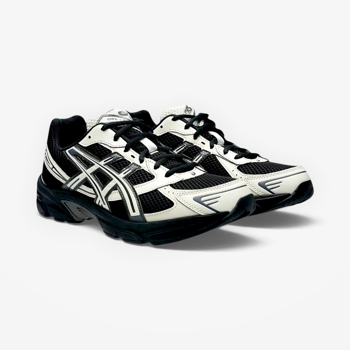 METRO ASICS GEL-1130 sneakers in black and cream with breathable mesh and synthetic overlays for retro running style.