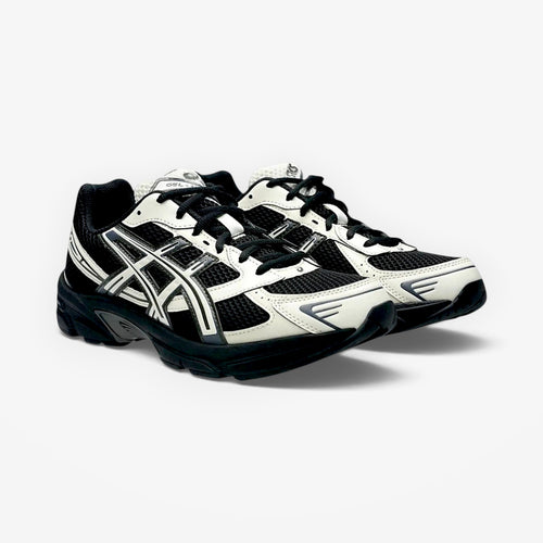 METRO ASICS GEL-1130 sneakers in black and cream with breathable mesh and synthetic overlays for retro running style.