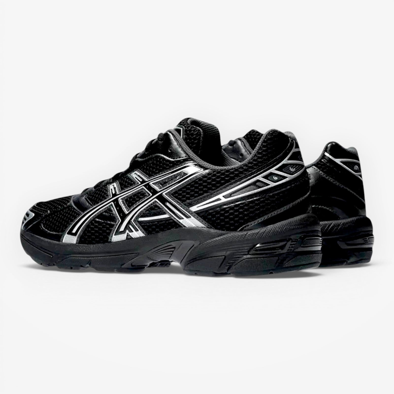 METRO ASICS GEL-1130 black and pure silver mesh and synthetic leather running shoes with GEL cushioning.