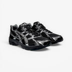 METRO ASICS GEL-1130 black and pure silver mesh and synthetic leather running shoes with GEL cushioning and TRUSSTIC support.