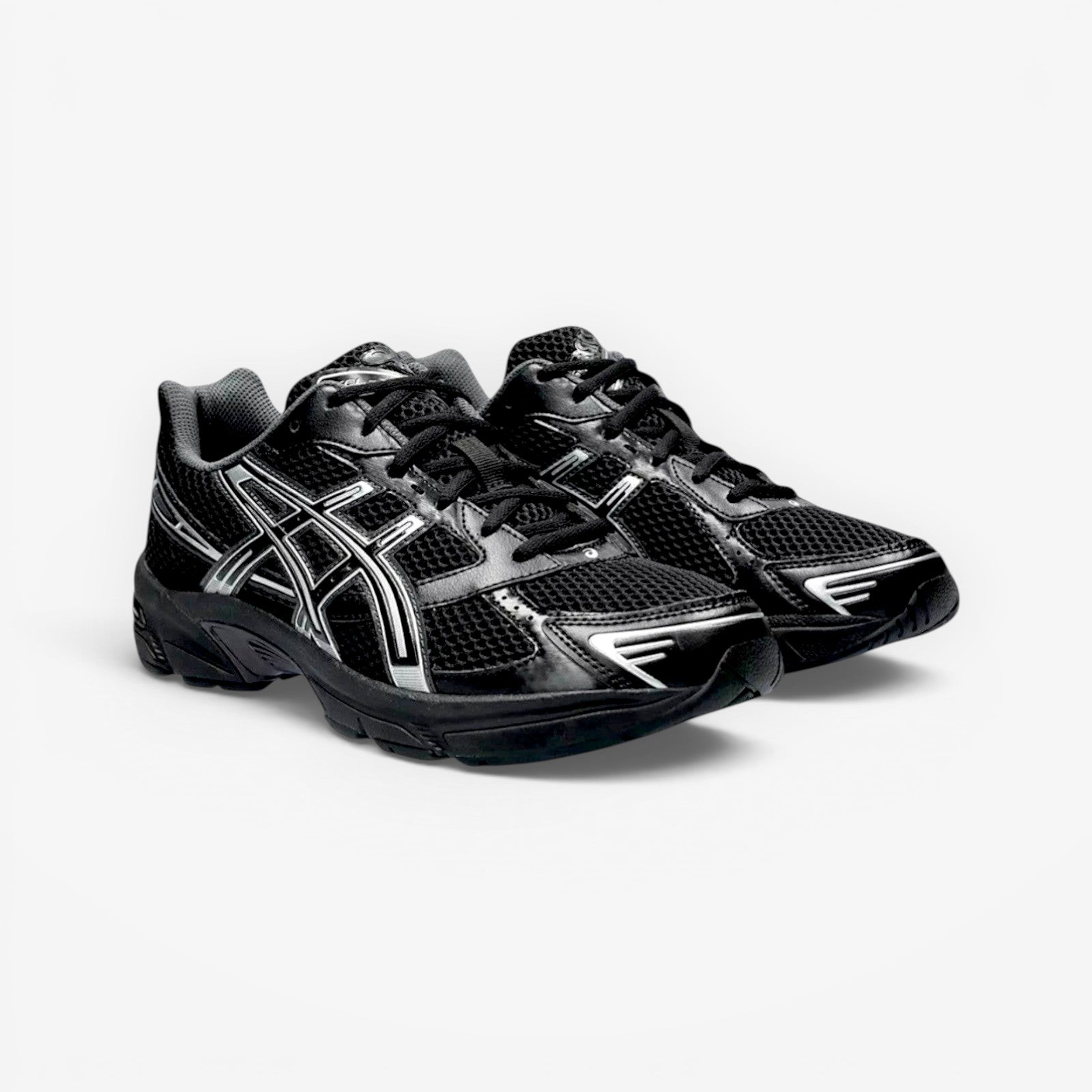 METRO ASICS GEL-1130 black and pure silver mesh and synthetic leather running shoes with GEL cushioning and TRUSSTIC support.