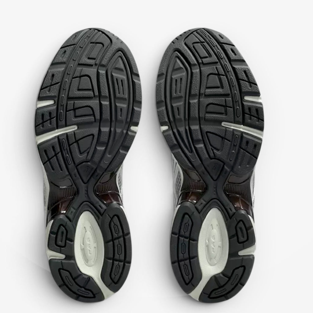 METRO ASICS GEL-1130 Mule sneaker outsoles in Piedmont Grey and Pure Silver with durable rubber traction patterns.