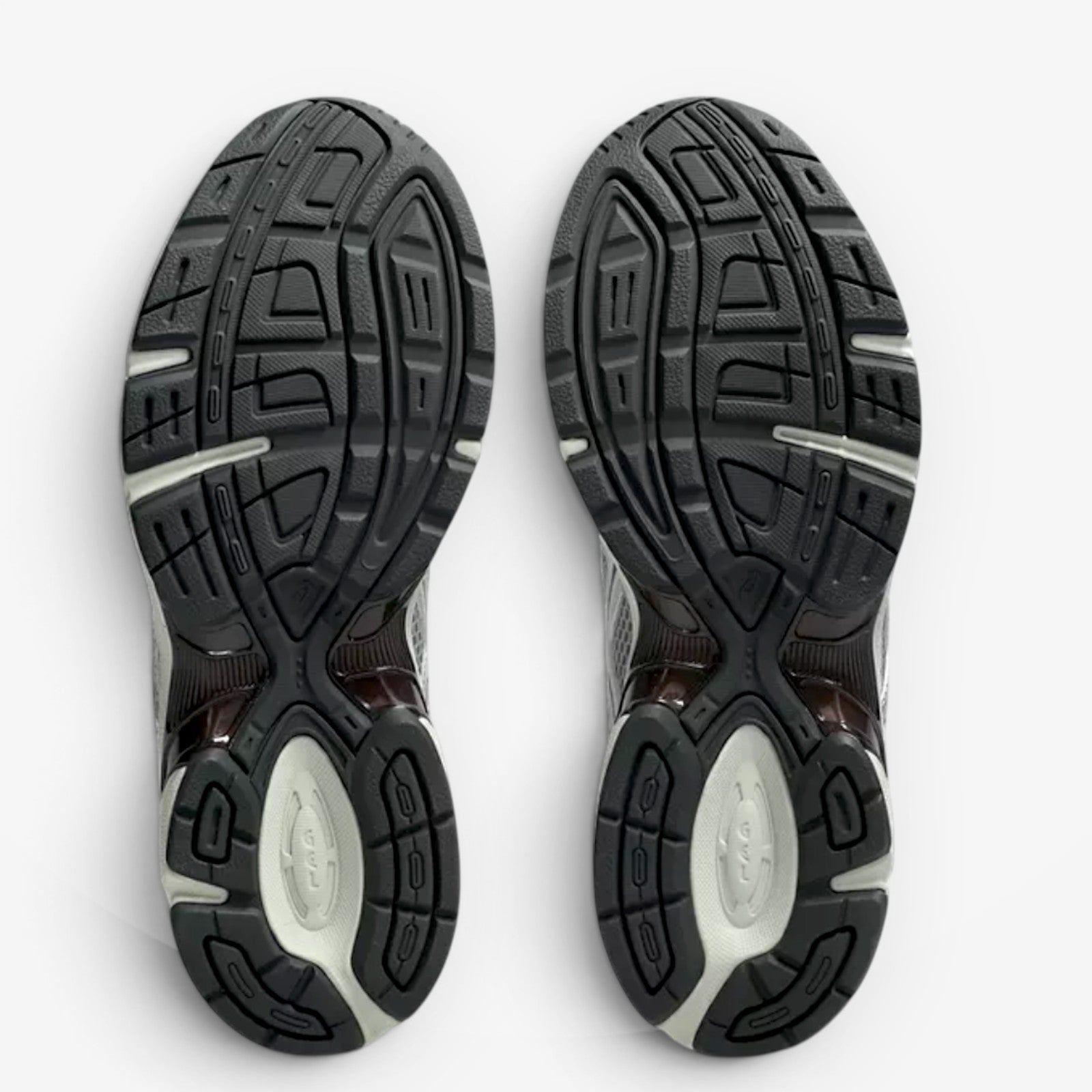 METRO ASICS GEL-1130 Mule sneaker outsoles in Piedmont Grey and Pure Silver with durable rubber traction patterns.