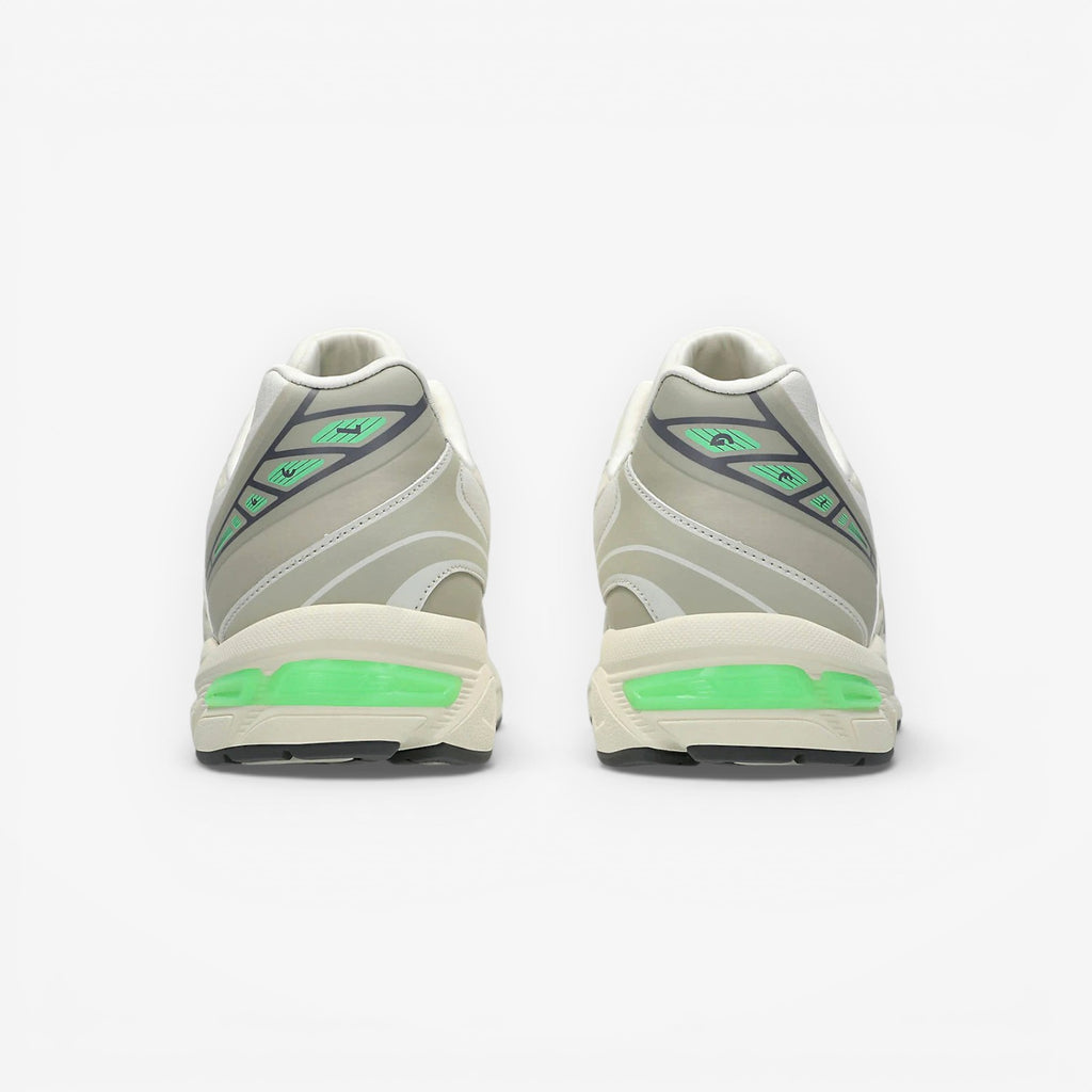 METRO ASICS GEL-1130 NS cream and carbon running shoes with green GEL cushioning and grey accents.