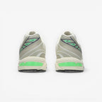 METRO ASICS GEL-1130 NS cream and carbon running shoes with green GEL cushioning and grey accents.