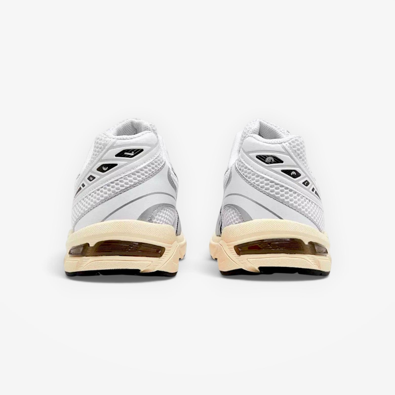 METRO ASICS GEL-1130 sneakers in white and cloud grey, rear view showing mesh upper and GEL cushioning heel detail.