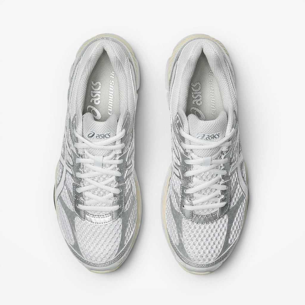 METRO ASICS GEL-Cumulus 16 white and silver mesh running shoes with synthetic overlays and lace-up closure.