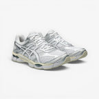 METRO ASICS GEL-Cumulus 16 white and silver mesh running shoes with synthetic overlays and GEL cushioning.