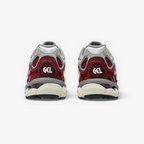 METRO ASICS GEL-NYC sneakers in beet juice and seal grey, showing the rear view with GEL branding and layered design.