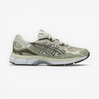 METRO ASICS GEL-NYC sneakers in khaki and pure silver with mesh, suede, and synthetic overlays. Features GEL cushioning and a rubber outsole.